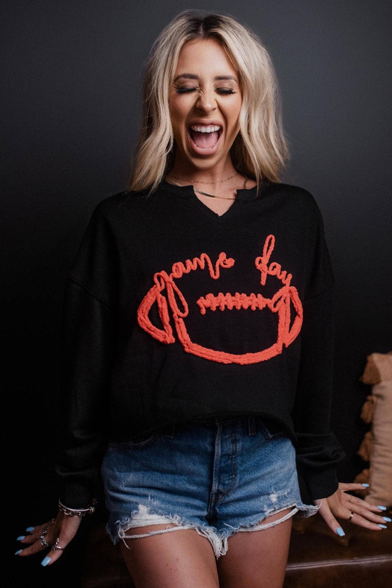 black and red yarn stitched football sweatshirt